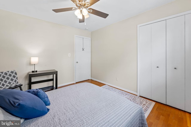 bedroom featuring wood finished floors, ceiling fan, and baseboards