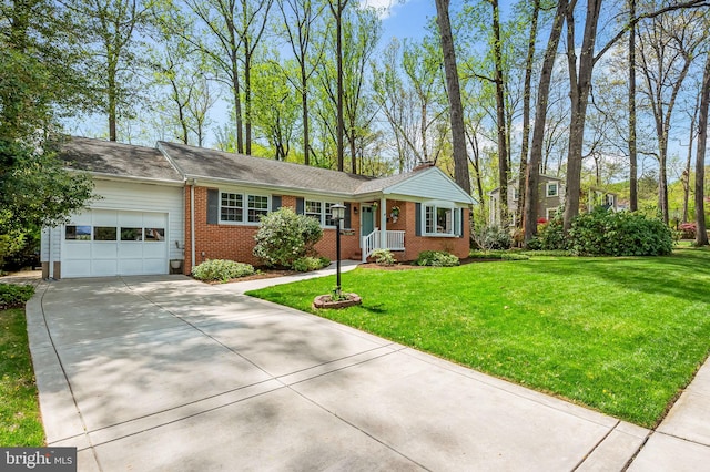 ranch-style house with concrete driveway, a chimney, brick siding, a front lawn, and a garage
