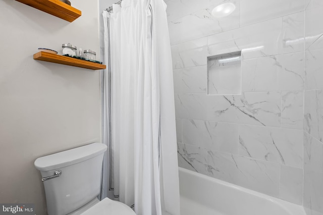 full bathroom with shower / tub combo and toilet