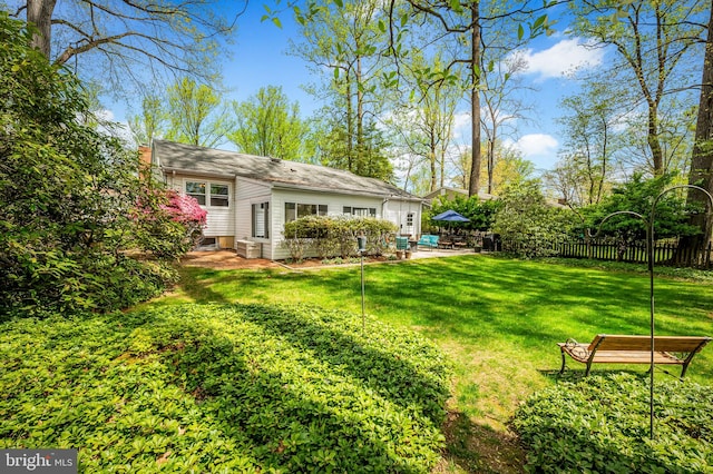 view of yard featuring a patio area and fence