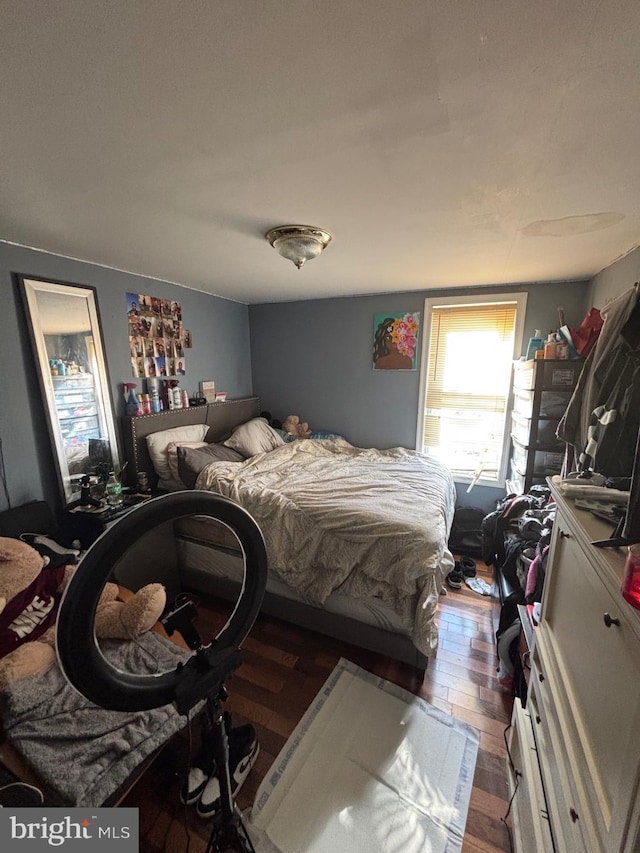 bedroom featuring wood finished floors