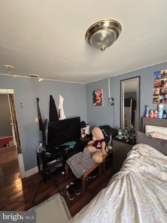 bedroom with wood finished floors