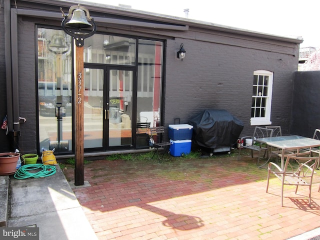 exterior space featuring grilling area and french doors