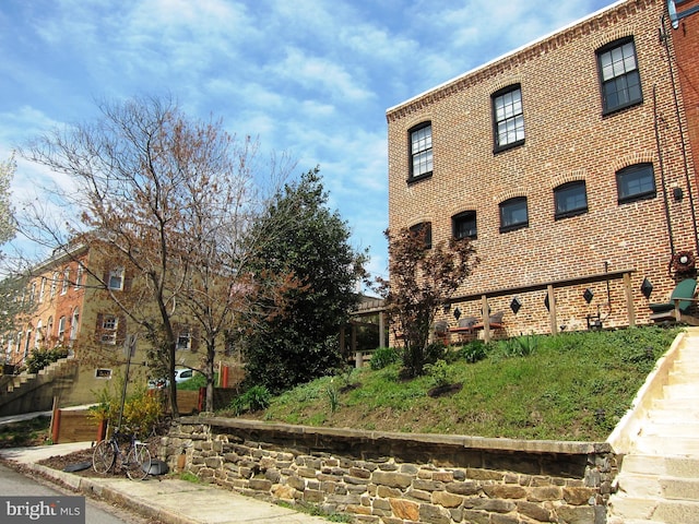 view of home's exterior featuring brick siding