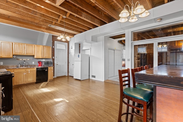 kitchen featuring visible vents, black appliances, light brown cabinetry, an inviting chandelier, and light wood finished floors