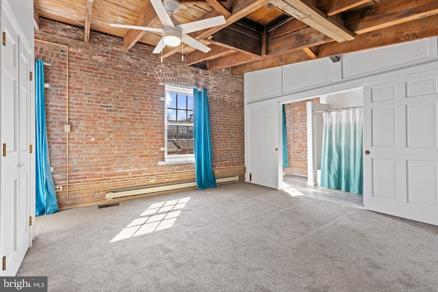 unfurnished bedroom featuring carpet flooring, beamed ceiling, brick wall, and visible vents