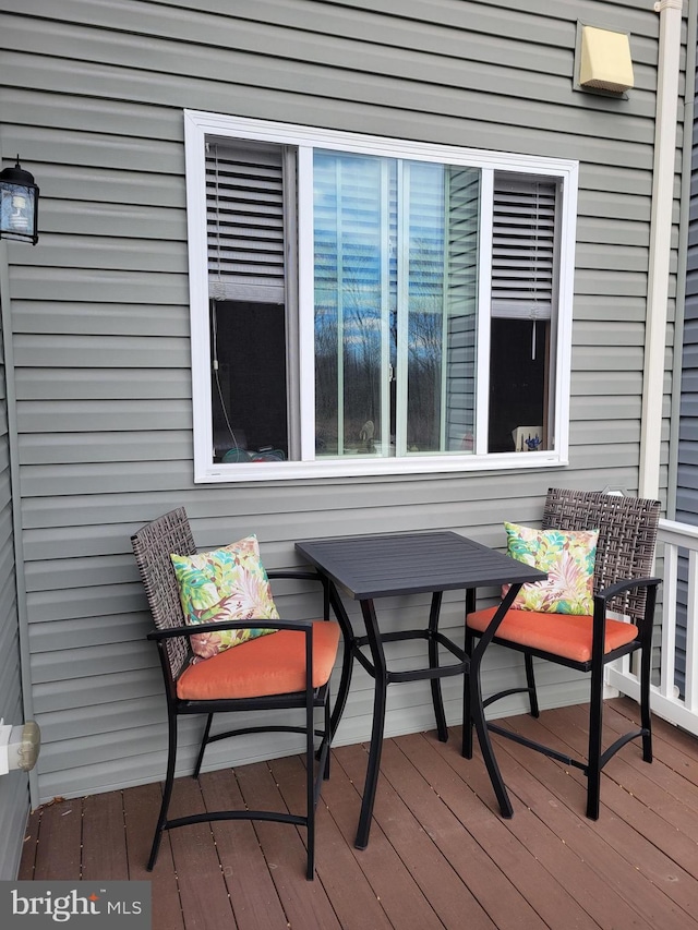 wooden deck with outdoor dining area