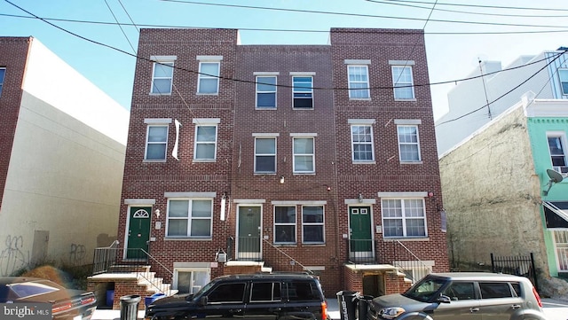 view of front of home with brick siding