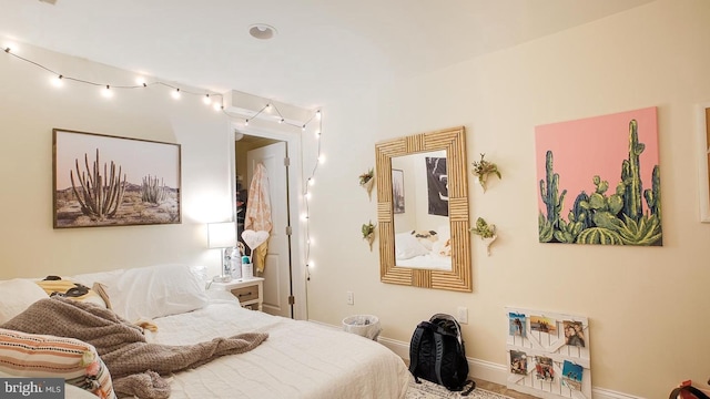 bedroom featuring baseboards