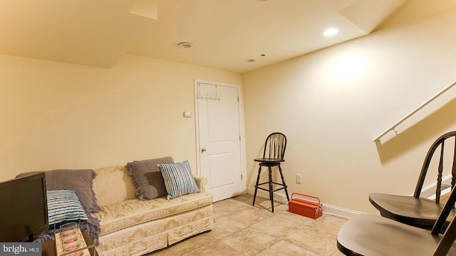 living room with baseboards and recessed lighting