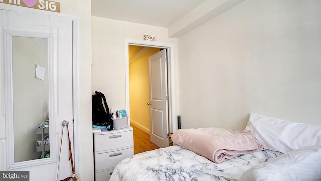 bedroom featuring wood finished floors