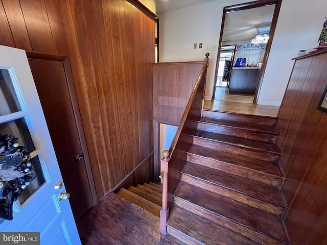 stairway featuring wood finished floors