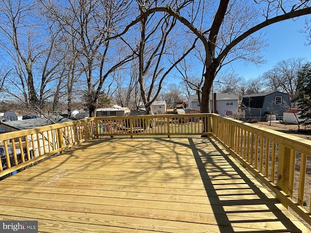 wooden deck featuring a residential view