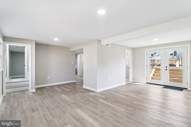 unfurnished room featuring light wood finished floors, recessed lighting, french doors, and baseboards