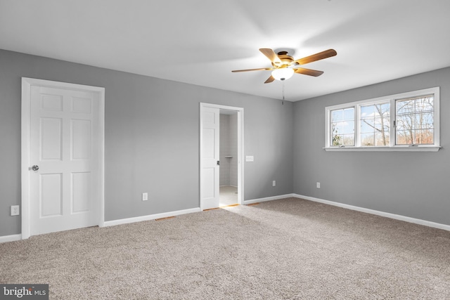 unfurnished bedroom featuring ceiling fan, carpet flooring, and baseboards