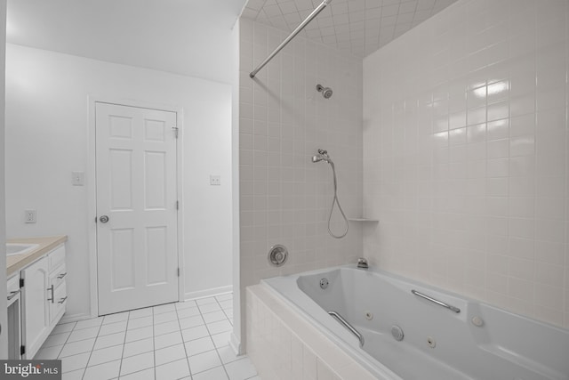 bathroom with baseboards, a combined bath / shower with jetted tub, vanity, and tile patterned floors