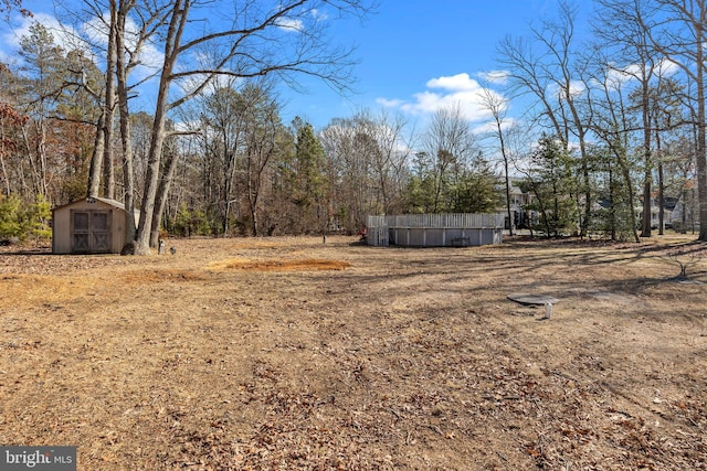 view of yard with a shed and an outdoor structure