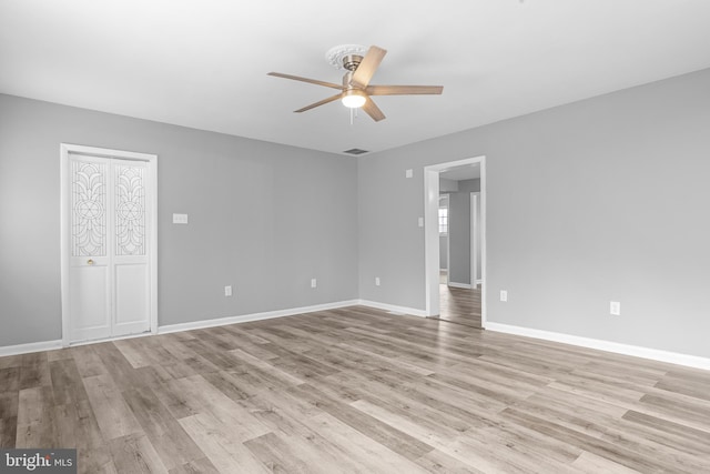 interior space with light wood-style floors, ceiling fan, and baseboards