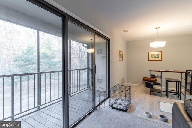 interior space featuring wood finished floors, visible vents, and baseboards