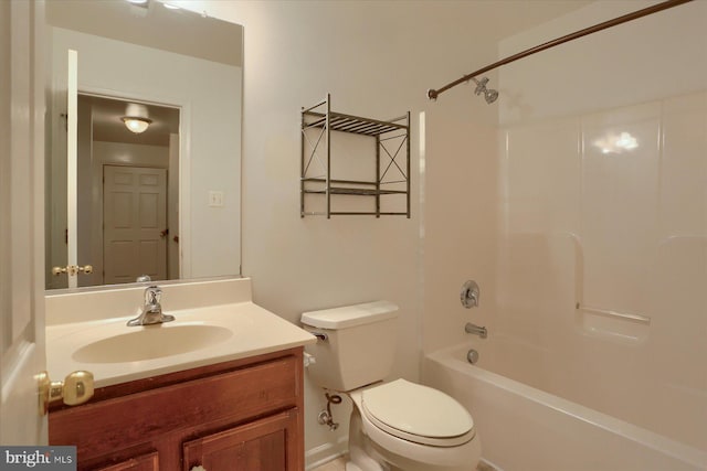 bathroom featuring toilet, shower / bathtub combination, and vanity