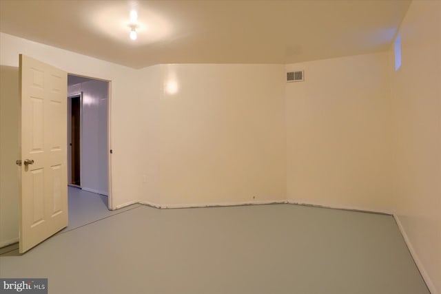 unfurnished room with visible vents and concrete floors