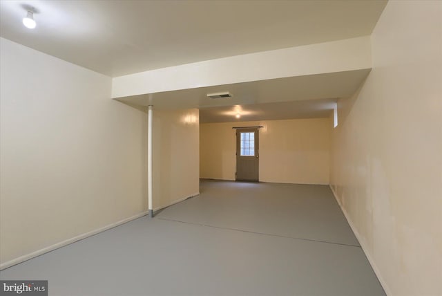 spare room with concrete floors and visible vents