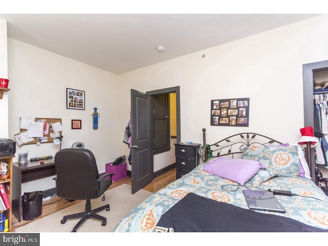 bedroom with wood finished floors