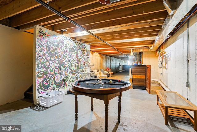 game room with concrete floors