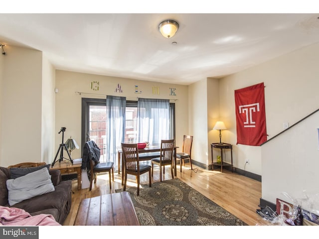 living room with baseboards and wood finished floors