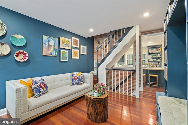 living room with recessed lighting, stairway, and hardwood / wood-style floors