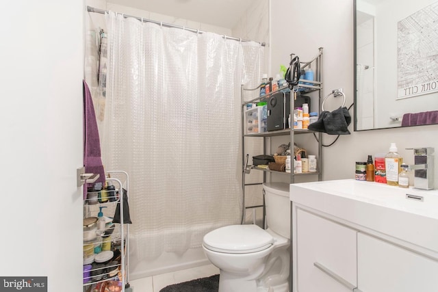 full bath featuring shower / bath combo with shower curtain, vanity, toilet, and tile patterned floors