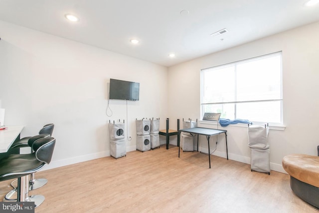 office featuring baseboards, visible vents, wood finished floors, and recessed lighting