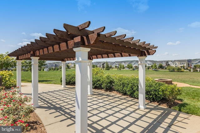 view of patio / terrace with a pergola and a residential view