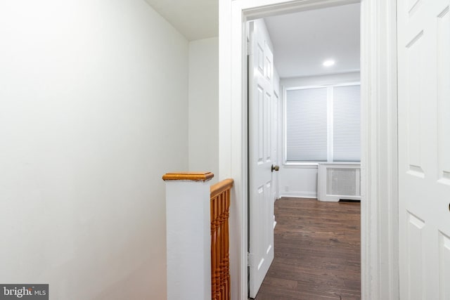 hall with dark wood-style flooring