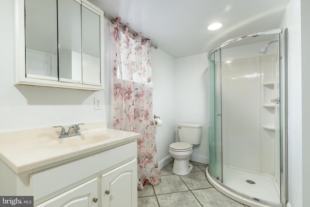 bathroom with vanity, a shower stall, toilet, and tile patterned floors