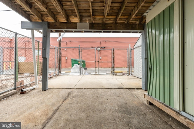 garage with fence and a gate