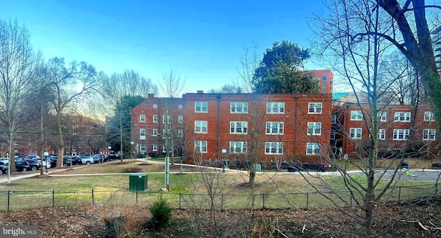 view of building exterior featuring fence