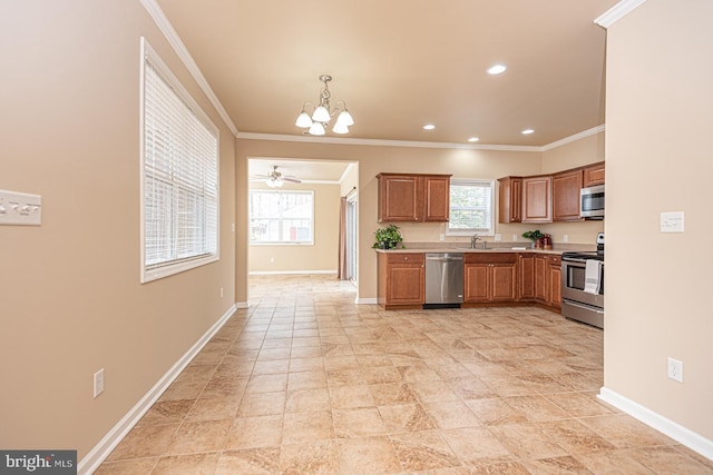 kitchen featuring a sink, stainless steel appliances, crown molding, and light countertops