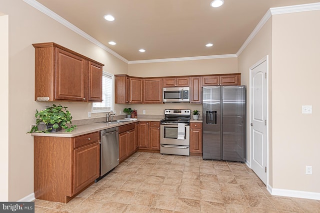 kitchen with a sink, stainless steel appliances, crown molding, and light countertops