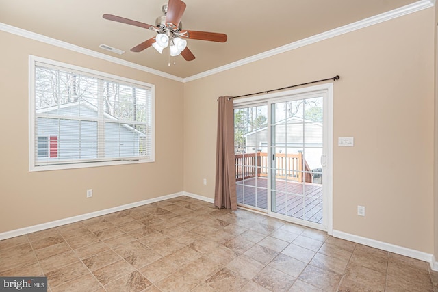 spare room featuring visible vents, baseboards, ceiling fan, and crown molding