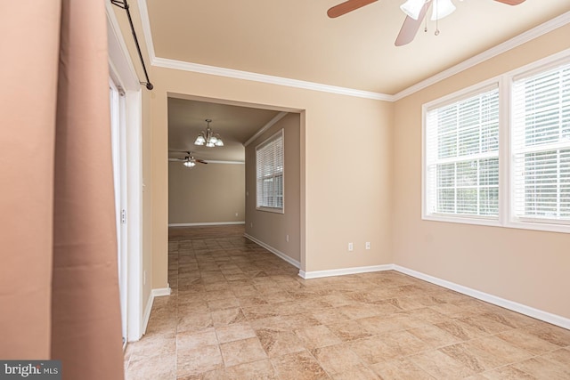 spare room featuring ceiling fan with notable chandelier, crown molding, and baseboards