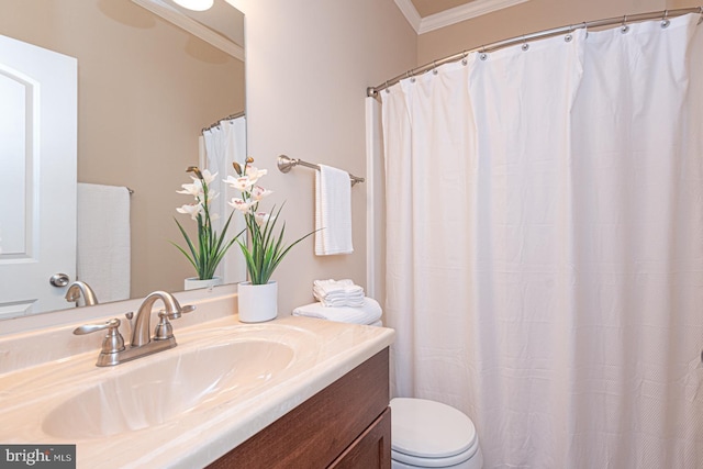 full bath featuring toilet, ornamental molding, and vanity