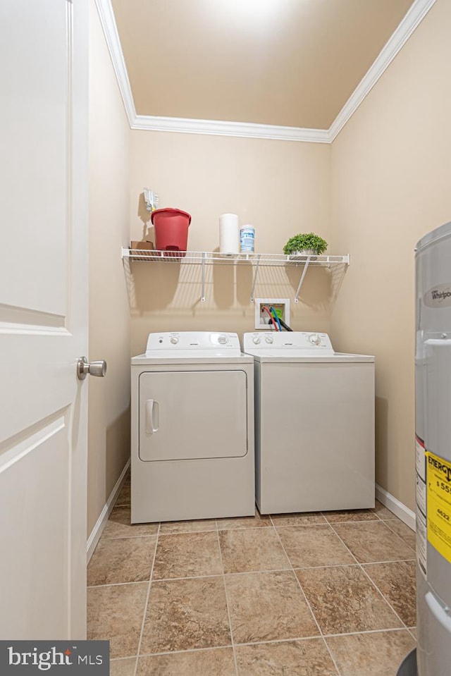 laundry room featuring laundry area, ornamental molding, water heater, and washer and clothes dryer