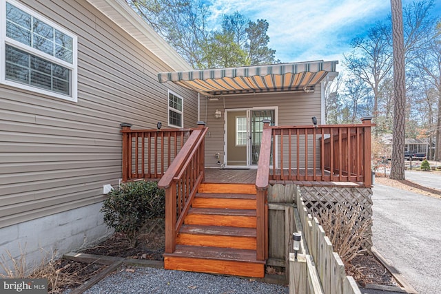 doorway to property featuring a deck