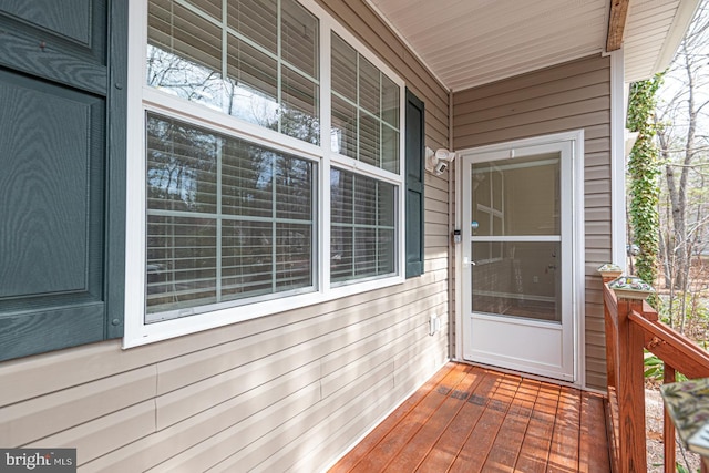 view of exterior entry with a porch