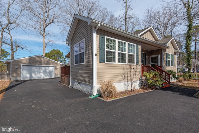 view of front facade featuring an outdoor structure, a garage, and crawl space