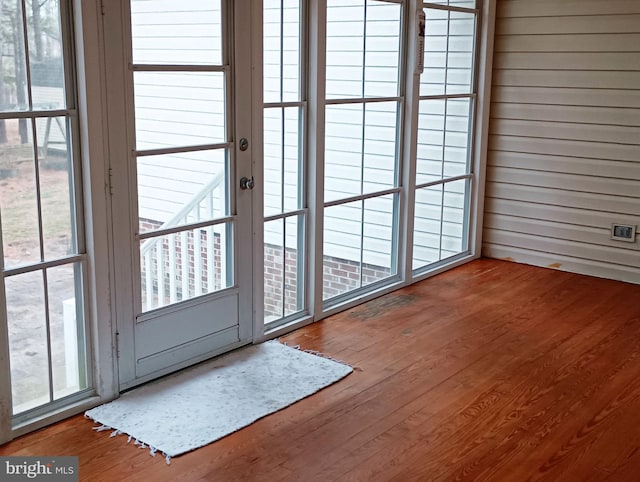 doorway with wood finished floors