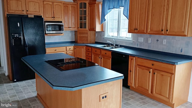 kitchen with backsplash, glass insert cabinets, a sink, a kitchen island, and black appliances