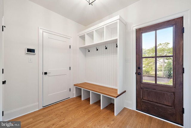 mudroom featuring light wood-type flooring and baseboards