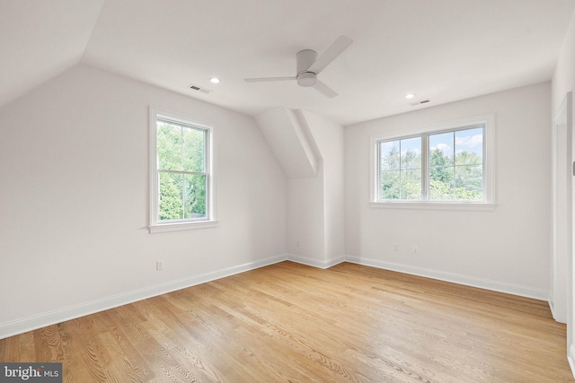 bonus room with visible vents, baseboards, and light wood finished floors